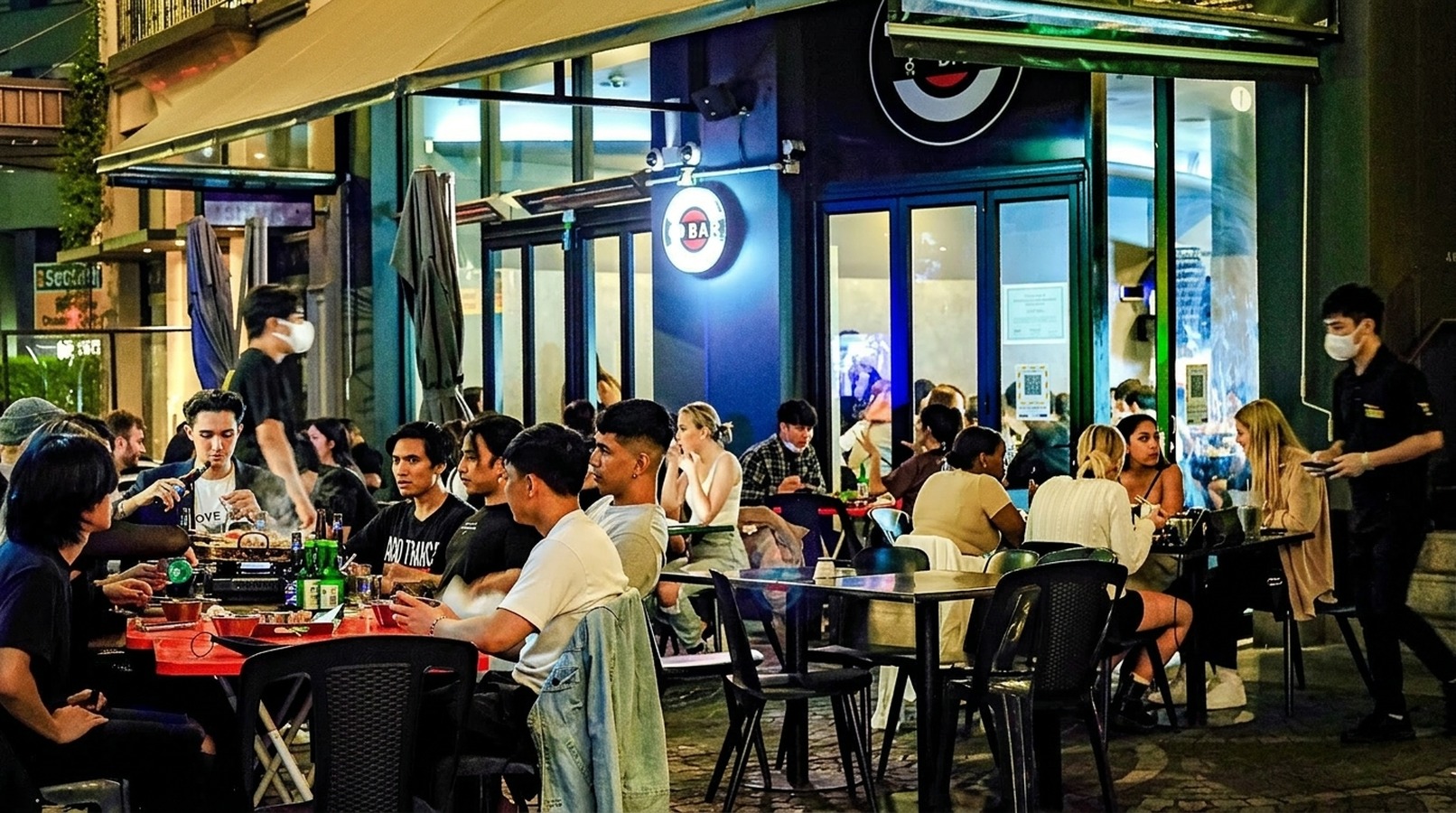 Bustling Bacons Lane outdoor lane dining and nightlife scene at OBAR Korean Restaurant Chancery Square Auckland